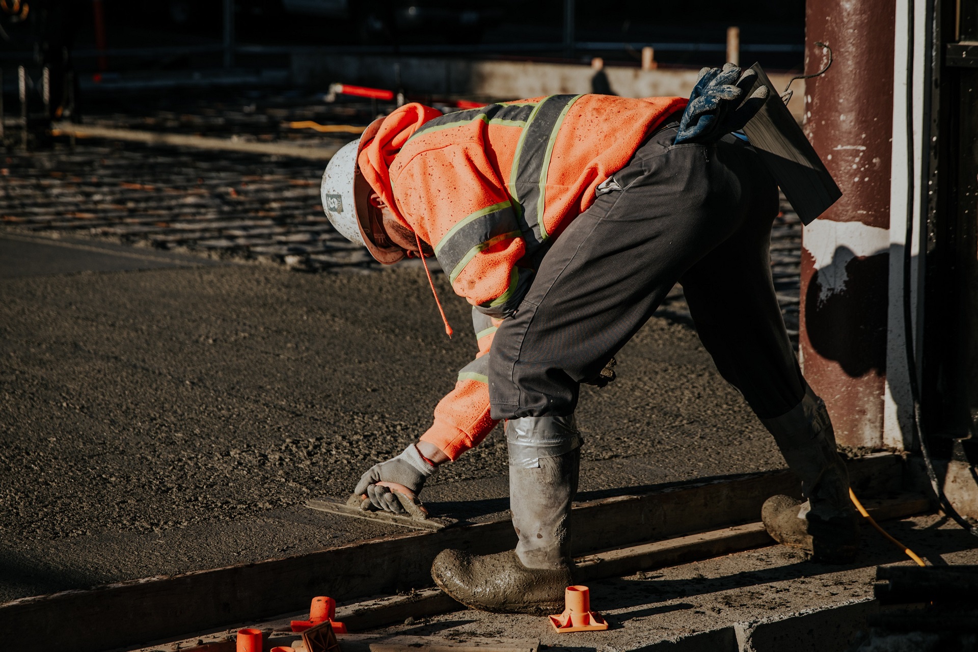 Trowling fresh concrete.